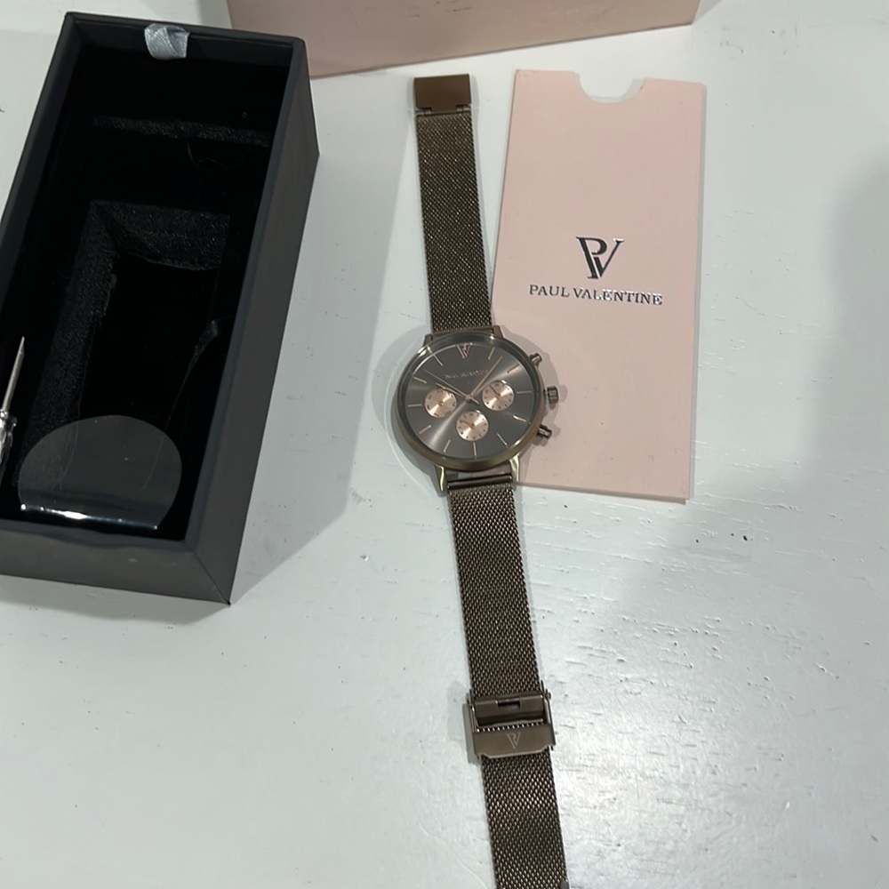 New Paul Valentine rose gold watch with original packaging.